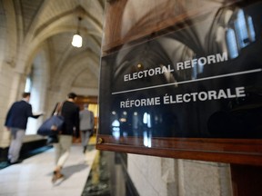 People arrive to an electoral reform committee on Parliament Hill in Ottawa on July 7, 2016.