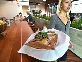 Cafe Linnea's bright, airy vibe is accentuated by the long planters and warm wood finishes.