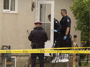 Police investigators enter a home at 11145 111 Avenue that is the scene of a double homicide on Friday, September 2, 2016 in Edmonton.