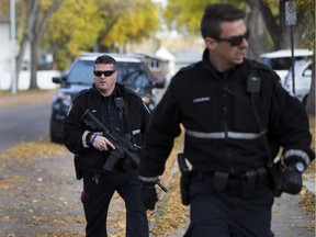Police surround a home on 93 Street on Thursday, Sept. 29, 2016 in Edmonton.