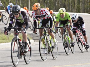 Riders in the peloton race in stage 3 of the Tour of Alberta in Drayton Valley, Alta., on Saturday, September 3, 2016.