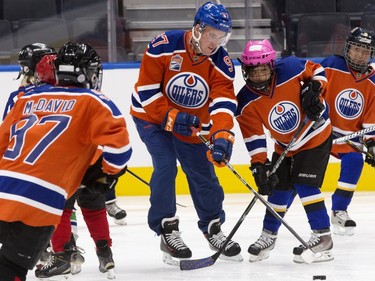 The Edmonton Oilers' Connor McDavid and players from the Edmonton Minor Hockey Association take the first skate on the ice at Rogers Place, in Edmonton on Thursday Sept. 1, 2016. Photo by David Bloom