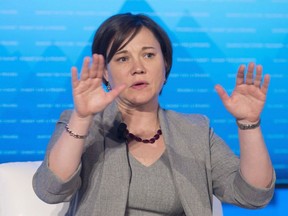 Alberta Minister of Environment and Parks Shannon Phillips responds to a questions during a discussion on the environment at the Progress summit in Ottawa on April 1, 2016. Phillips says Alberta is prepared to financially support renewable power projects worth $10.5 billion to achieve its goal of having 30 per cent of the province's power come from renewable sources by 2030.