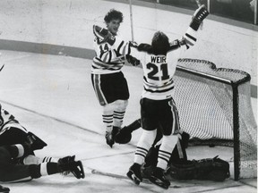 Stan Weir and Blair MacDonald celebrate after a goal on Rogie Vachon in the Oilers first home game as an NHL team
October 13, 1979.