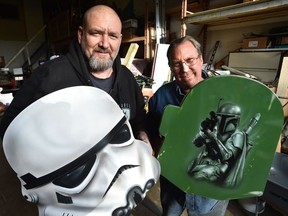 Star Wars-themed tables designed by Kevin Wilson (left) and built by Gary Hall showcase their artistic talent.