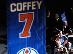 No. 7 is added to the Oilers retired list in a ceremony before a game Oct. 18, 2005, at Edmonton's Rexall Place as Paul Coffey, wiping away a tear, looks on.