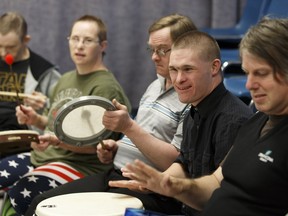 Percussionists play a song during a rehearsal of All-In Music, a collaboration between  adults with developmental disabilities and professional musicians.