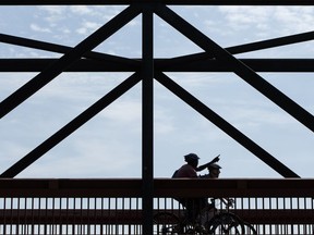 Cyclists cross the Cloverdale bridge in July 2016. The bridge is slated for demolition as part of the Valley Line LRT project. Emily Hoven writes some of Edmonton's stories will be lost when the bridge comes down.
