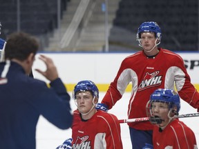 Edmonton Oil Kings defenceman Travis Verveda (right) listens during a practice at Rogers Place in Edmonton on Sept. 15, 2016.