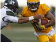 Golden Bears wide receiver Tylor Henry runs through Huskies defence as the University of Alberta Golden Bears play the Saskatchewan Huskies at Foote Field in Edmonton, Alberta on Friday, September 9, 2016.