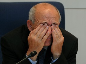 City of Edmonton Mayor Stephen Mandel rubs his eyes during a discussion at city hall about the proposed downtown arena on Wednesday October 17, 2012.