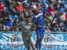 Tom Ameobi of FC Edmonton, gets a touch on the ball before Ramon Martin Del Campo of Puerto Rico FC at Clark Field. The two NASL teams played to a 0-0 draw on Aug. 28, 2016.