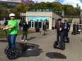 Chris Szydlowski, owner of River Valley Adventure Co., leads former Alberta Tourism Minister David Eggen and other dignitaries on a Segway ride last summer in the river valley.