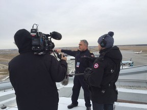 Edmonton International Airport fire Chief Burl Hamm is interviewed by a crew filming Airport: Below Zero a reality TV show debuting on Oct. 5 on History.