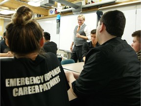 Alberta Education Minister David Eggen talks with Emergency Response Career Pathways students at Centre High School on Wednesday.