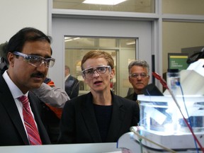 University of Alberta chemistry professor Jillian Buriak demonstrates to federal infrastructure minister Amarjeet Sohi research that uses energy from the sun to split water into clean-burning hydrogen fuel. Sohi announced on Sept. 6, 2016, the university will receive a $75 million  grant from the Canada First Excellence Research fund.