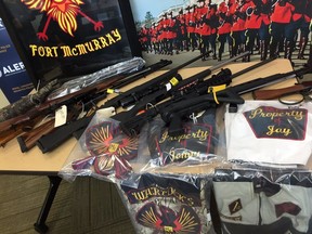 Weapons, ammo, vests and posters seized by RCMP while investigating the Syndicate and Warlocks motorcycle clubs.