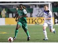 FC Edmonton midfielder Nik Ledgerwood, right, chases down New York Cosmos midfielder Lucky Mkosana in a North American Soccer League game Saturday Sept. 17, 2016 in Hempstead, NY. The game finished in a scoreless tie.