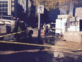 Workers on the scene of water main break at the Edmonton courthouse on Sept. 22, 2016.