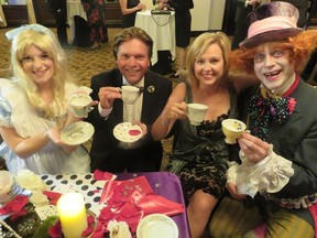 Wooing guests at the Kids Kottage Alice in Wonderland gala on Sept. 23, 2016 at the Chateau Lacombe were (l to r): Alice, played by Mhairi Berg; emcees Thomas Lukaszuk and wife, CTV morning news anchor Stacey Brotzel and Mad Hatter Tom Edwards of Die Nasty Theatre.