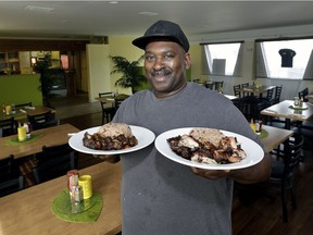 Warren Edwards (owner/cook) in the dining room at the Island Grill restaurant.