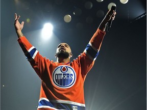 Wearing an Edmonton Oilers Connor McDavid jersey, Drake performs at Rogers Place in Edmonton, Tuesday, September 20, 2016.