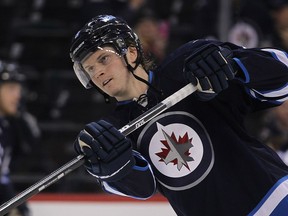 Winnipeg Jets defenceman Jacob Trouba works out  during the pre game skate prior to playing the Colorado Avalanche in NHL hockey in Winnipeg, Man. Thursday, December 12, 2013. Brian Donogh/Winnipeg Sun/QMI Agency ORG XMIT: POS1607240214026559