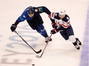 TORONTO, ON - SEPTEMBER 17: Patrick Kane #88 of Team USA tries to get around the stick of Leon Draisaitl #29 of Team Europe during the second period during the World Cup of Hockey tournament on September 17, 2016 in Toronto, Canada.