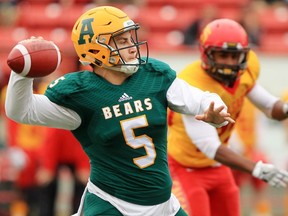 University of Alberta Golden Bears quarterback Ben Kopczynski lines up a pass during Canada West football action against the U of C Dinos at McMahon Stadium in Calgary on Saturday Oct. 1, 2016.