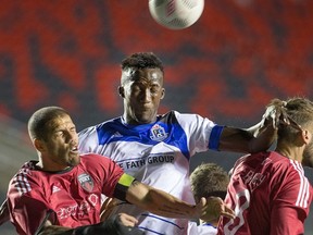 Ottawa Fury defender Rafael Alves, left, and FC Edmonton defender Papé Diakité, challenge for the ball along with James Bailey, right, in an NASL game at TD Place stadium earlier this year. Ottawa announced it was leaving the NASL and joining the United Soccer League.