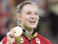 Canada's Rosie MacLennan, from King City, Ont., holds up her gold medal after winning the trampoline gymnastics competition at the 2016 Summer Olympics Friday, August 12, 2016 in Rio de Janeiro, Brazil.THE CANADIAN PRESS/Ryan Remiorz ORG XMIT: RYR110