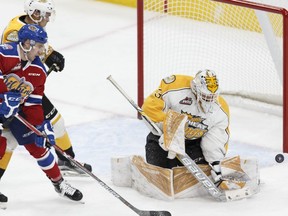 Edmonton Oil Kings forward Kobe Mohr, left, is stopped by Brandon's goaltender Jordan Papirny during a WHL game between the Edmonton Oil Kings and the Brandon Wheat Kings at Rogers Place in Edmonton, Alberta on Tuesday, October 25, 2016.