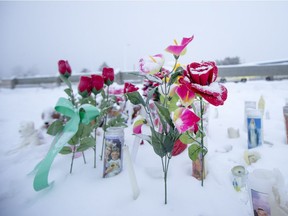 A memorial just outside of the school grounds still sits after two days after a school shooting at La Loche Community School on Jan. 24, 2016.
