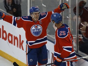 Darnell Nurse #25 celebrates his second period goal with Connor McDavid #97 during the 2016 Tim Hortons NHL Heritage Classic hockey game on Oct. 23, 2016 at Investors Group Field in Winnipeg.