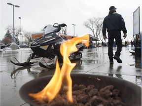 A small flame draws people to the registration table for the outdoor parts swap. The Alberta Snowmobile and Powersports show at the Edmonton Expo Centre on October 15, 2016.