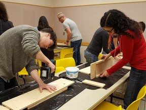 Alberta Culture and Tourism staff work together to build 20 bat boxes to provide important habitat on EALT lands.