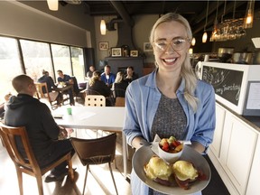 Server Melanie Bahniuk shows off the eggs Benedict at Cafe Haven during brunch at the restaurant in Sherwood Park.