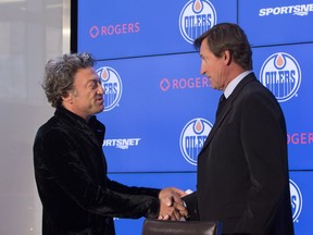 Daryl Katz shakes hands with Wayne Gretzky during a press conference announcing Gretzky will be re-joining the organization in an off-ice role in Edmonton, Alta., on Wednesday October 12, 2016.