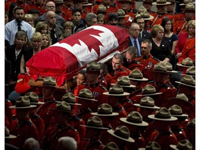The casket of slain RCMP Const. David Wynn is carried into funeral in St. Albert on Monday,  Jan. 26, 2015. Wynn died four days after he and Auxiliary Const. Derek Bond were shot by Shawn Rehn in St. Albert on January 17.