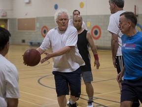 Don Kuiken passes the ball as he plays with a group of players, many of whom are in their 60's and 70's . They are playing at at Rutherford School on Monday, October 17, 2016 but will often play at the University of Alberta.