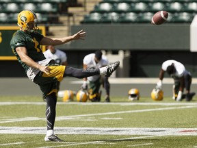 Grant Shaw kicks the ball during Edmonton Eskimos practice at Commonwealth Stadium during practice in August.