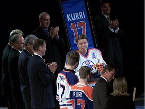 Jari Kurri, middle, during his Edmonton Oilers jersey number retirement banner raising ceremony at Skyreach Centre on Oct. 6, 2001.