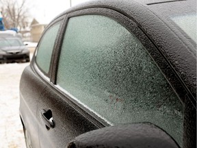 A car in downtown Edmonton is coated in ice during a freezing rainstorm in January 2014.