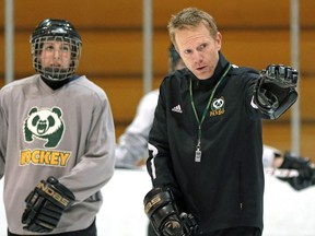 EDMONTON, ALBERTA: JANUARY 28, 2015 - University of Alberta Pandas' head coach Howie Draper (right) gives instruction during team practice at Clare Drake Arena on January 28, 2014. Story by Richard Cantangay-Liew. (PHOTO BY LARRY WONG/EDMONTON JOURNAL)