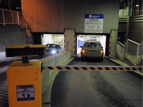 Vehicles arrive and depart the entrance the underground parkade at the University of Alberta Hospital in a 2011 file photo.