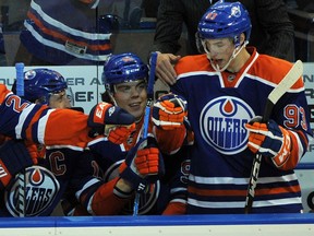 Edmonton Oilers celebrate Ryan Nugent-Hopkins's first NHL goal to tie the game against the Pittsburgh Penguins at Rexall Place in Edmonton, Oct. 9, 2011, in the teams' season-opening game.