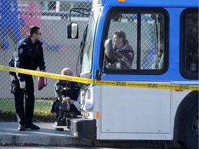 Police investigate the stabbing of a man at around 6:15 a.m. on an ETS Bus at the Coliseum Transit Station in Edmonton on Friday Oct. 17, 2014.
