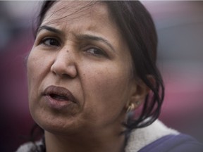 Gurpreet Sidhu speaks to media by the Rabbit Hill Road and Hodgson Boulevard intersection where her husband, Paramjeet Sidhu, was struck and killed by a vehicle on Oct. 5, 2014.