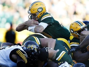 Edmonton Eskimos Mike Reilly (13) dives for a first don on a quarterback sneak against the Hamilton Tiger-Cats during second half action at Commonwealth Stadium on Saturday, July 23, 2016 in Edmonton. Greg Southam / Postmedia Photos for various stories, columns (Gerry Moddejonge, terry Jones, Dan Barnes) running in Sunday, July 24 edition.