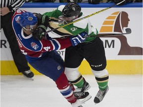 Edmonton Oil Kings Aaron Irving is hit by Prince Albert Raiders Dalton Yorke during first period WHL action on Friday, October 21, 2016 in Edmonton.